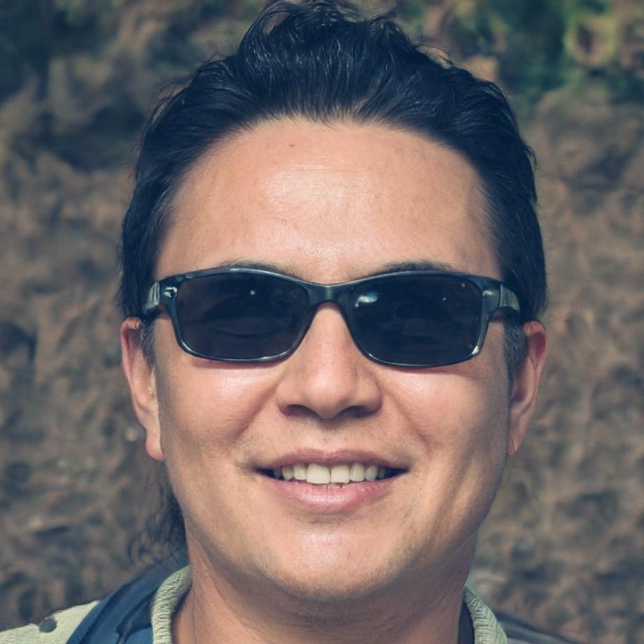 Forest ecologist Henrik Nordstrom examining tree core samples in mixed conifer stand